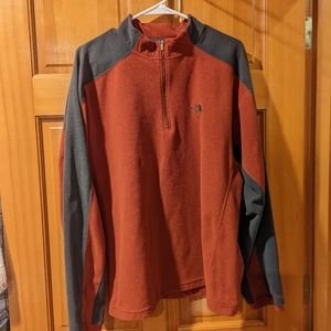 Pumpkin orange and grey North Face quarter zip fleece pullover